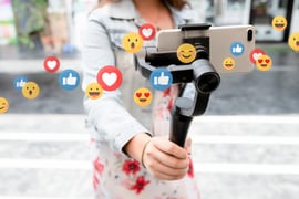 A person recording a video and getting a lot of likes. 