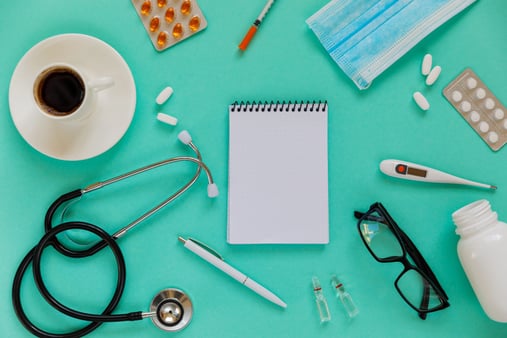 The concept of diversity in preventive care and otherwise. The top of a doctor's desk with various health elements. 