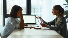 Two businesspeople having an empathetic conversation
