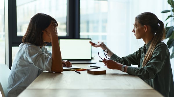 Two businesspeople having an empathetic conversation