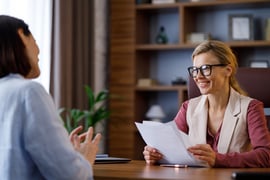 Professionals speaking in an office.