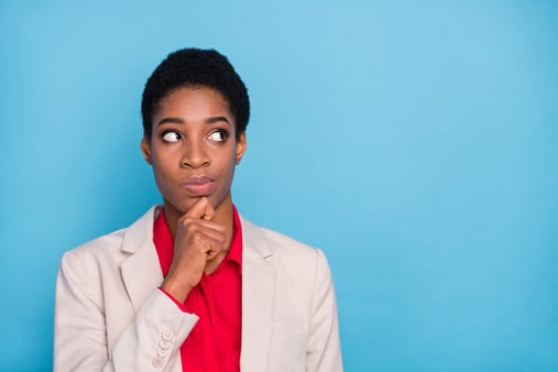 Businesswoman thinking about selling her agency