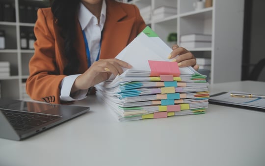 Person looking through plan documents 