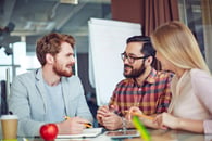 Three colleagues interacting about new strategies