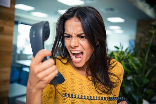 Business Women yelling Into Phone