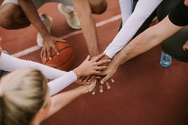 The concept of a team sport. A team playing basketball. 
