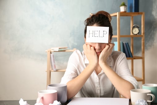 Woman who is experiencing burnout and needs help to be more productive 