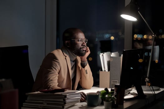 Disgruntled and sad person sitting at the computer