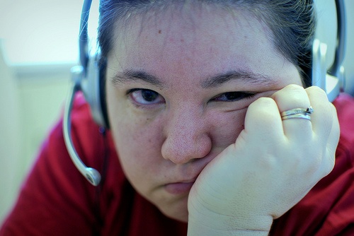 Women resting her hand on her cheek 