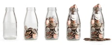 Milk bottles with change in them 