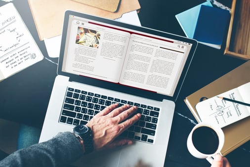 A person reading on the computer 