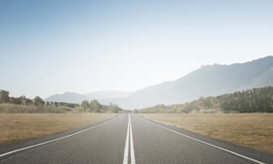Concept of straight and steady progress over time. A road leading into the distance. 
