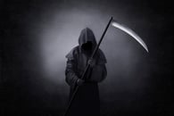 A man dressed up as the Grim Reaper