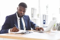 A businessperson studying to improve. 