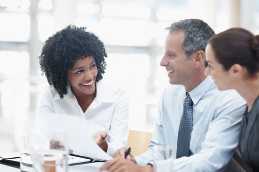 Salesperson/producer talking with clients