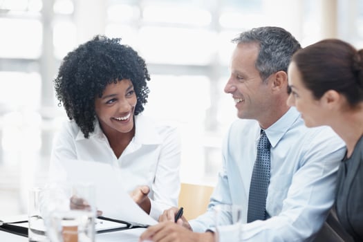 Salesperson/producer talking with clients