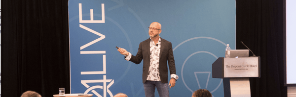 Kevin Trokey speaking to a crowd at Q4Live