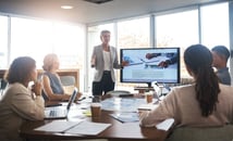 A businessperson giving a seminar and other businesspeople learning