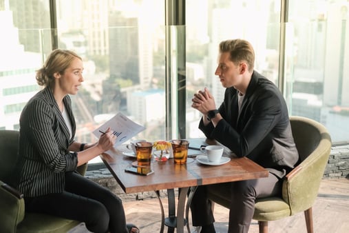 Two businesspeople talking to each other and building trust