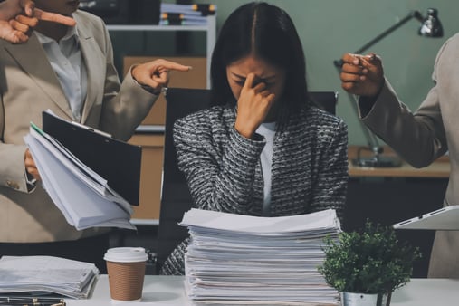 The concept of urgency culture. People surrounding a person wanting a bunch of things done 