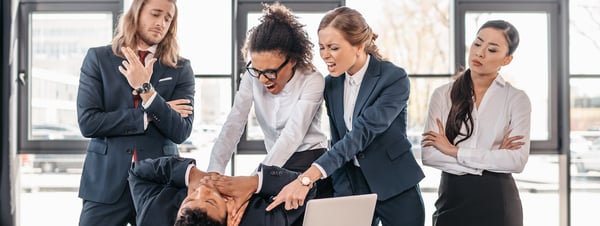 Team of business people fighting