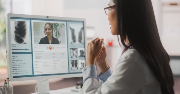 Woman sitting in front of a computer researching medical advice