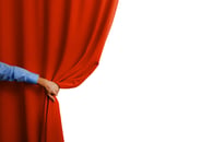 Someone pulling back a curtain