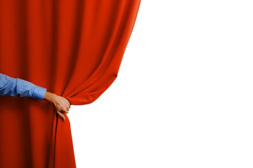 Someone pulling back a curtain