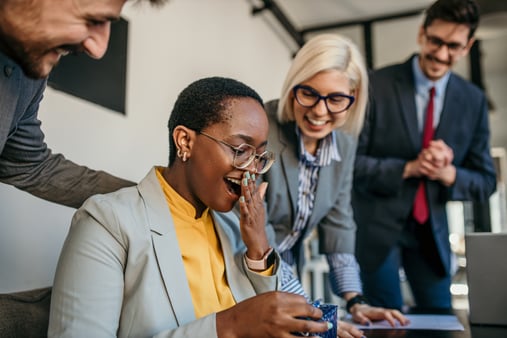 Employees working together and coming together as a team.