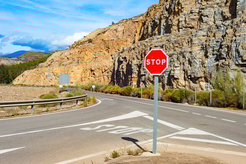 Stop sign by a road 