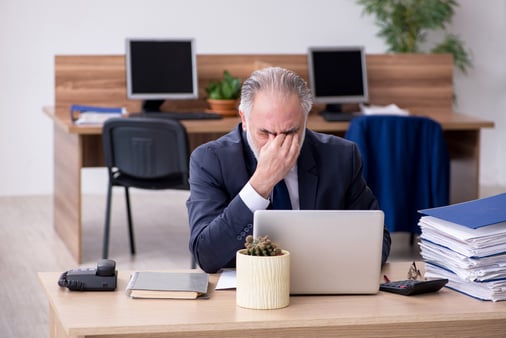 A businessperson with impostor syndrome thinking they're not good enough 