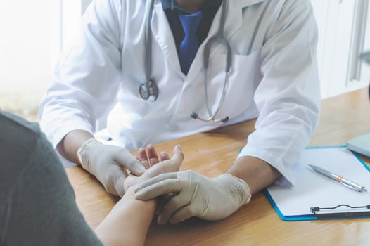 A healthcare provider and a patient getting preventive care