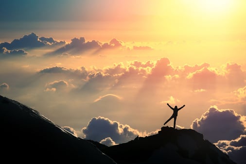 Someone standing on top of a mountain 