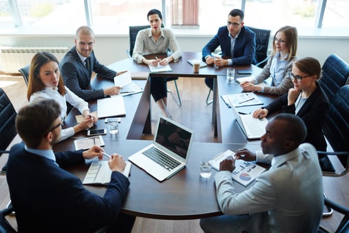 A diverse group of professionals collaborating in a modern office, representing a variety of team strengths.