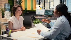 An employee discussing employee benefits with HR