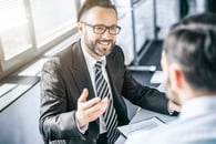 Benefits advisor leading a consultative sales conversation with a client