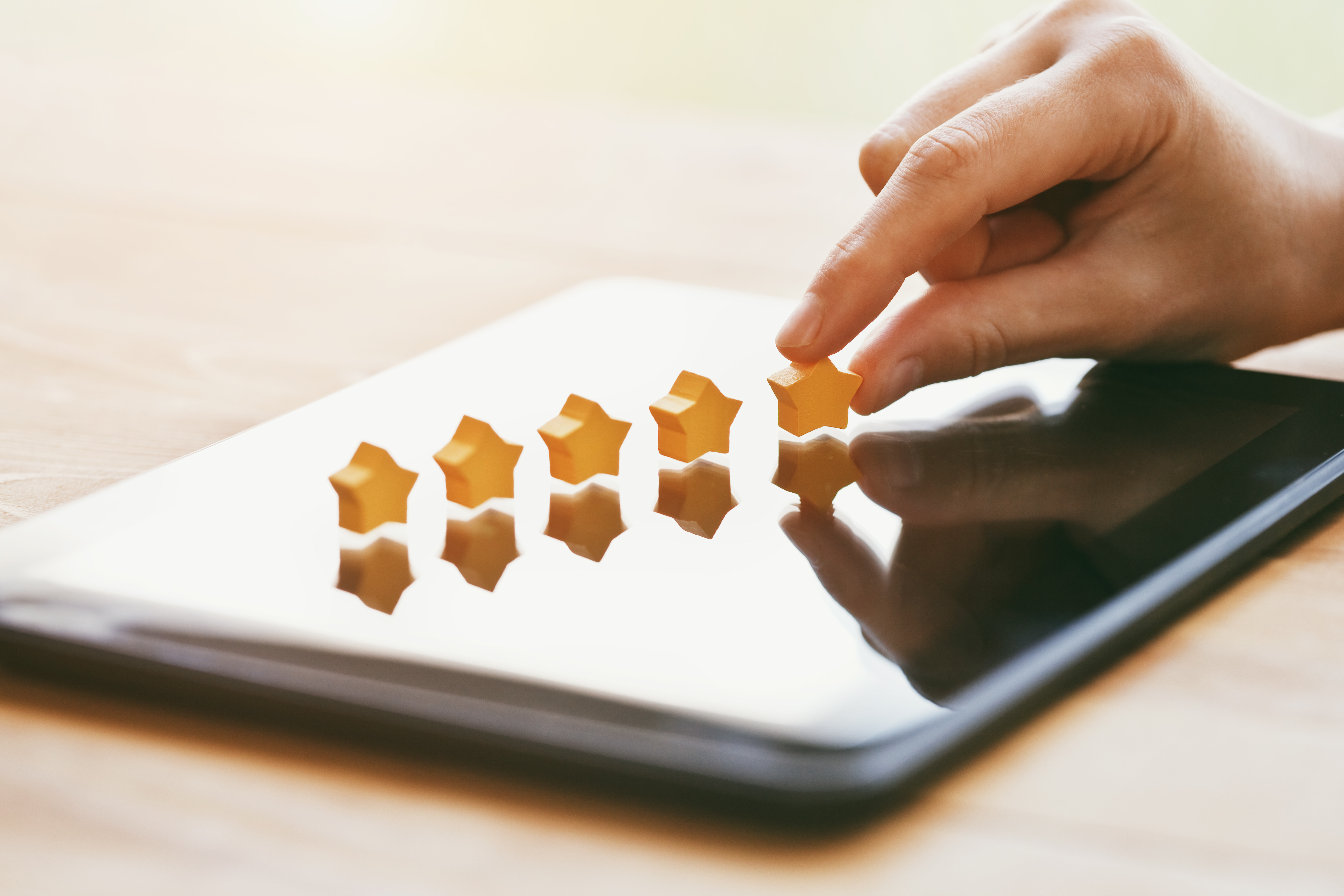 Five stars placed on top of a tablet