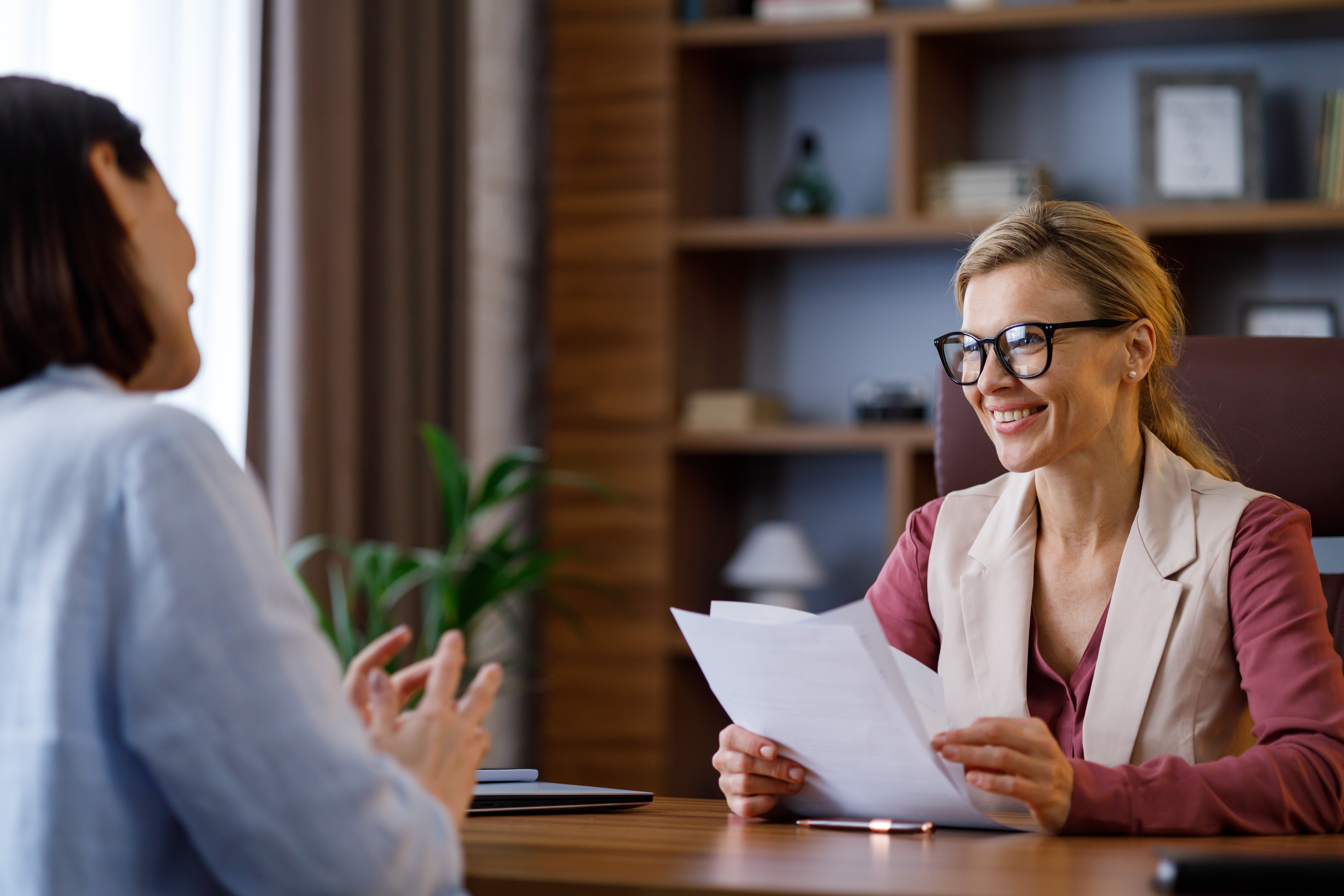 Professionals speaking in an office.
