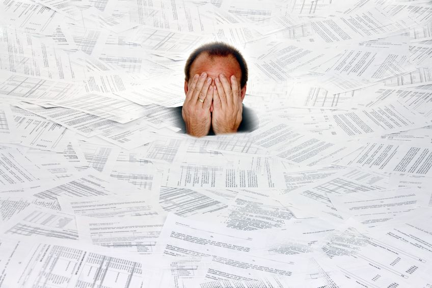 Man drowning in too many insurance benefits and solutions choices