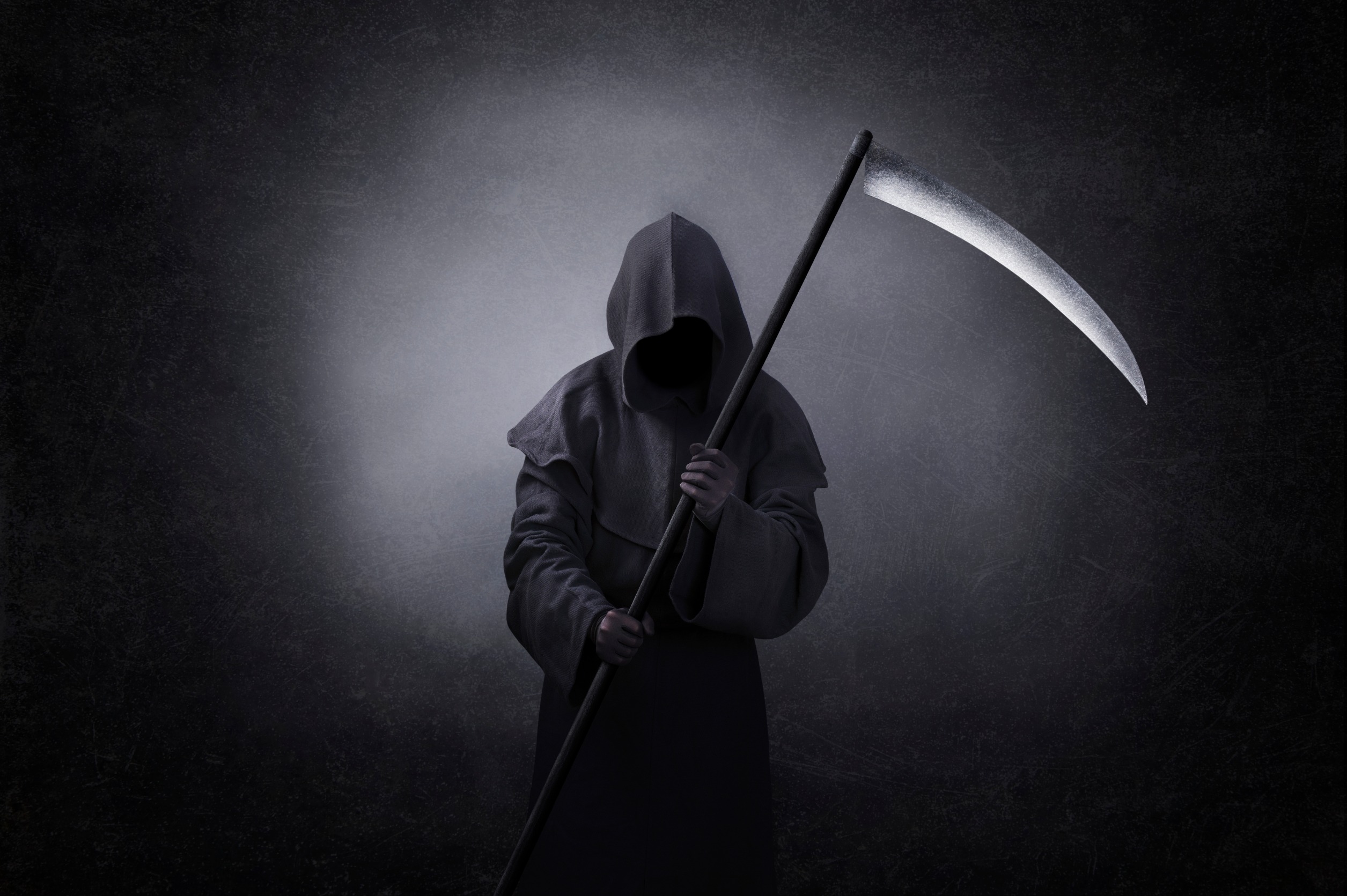A man dressed up as the Grim Reaper