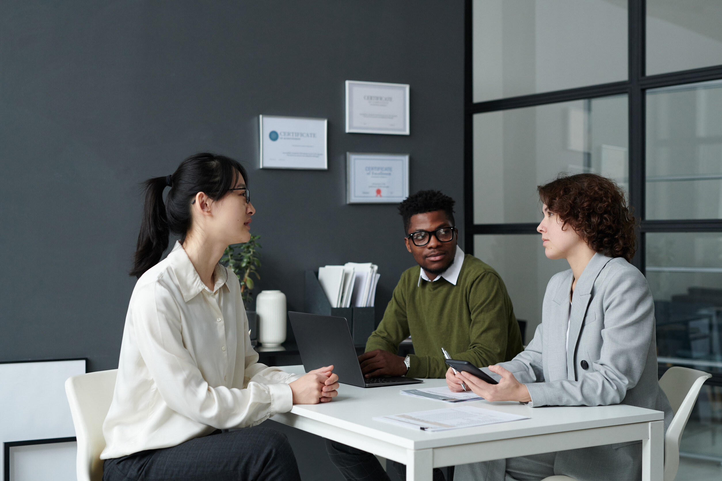 Three people having an uncomfortable, but necessary, conversation 