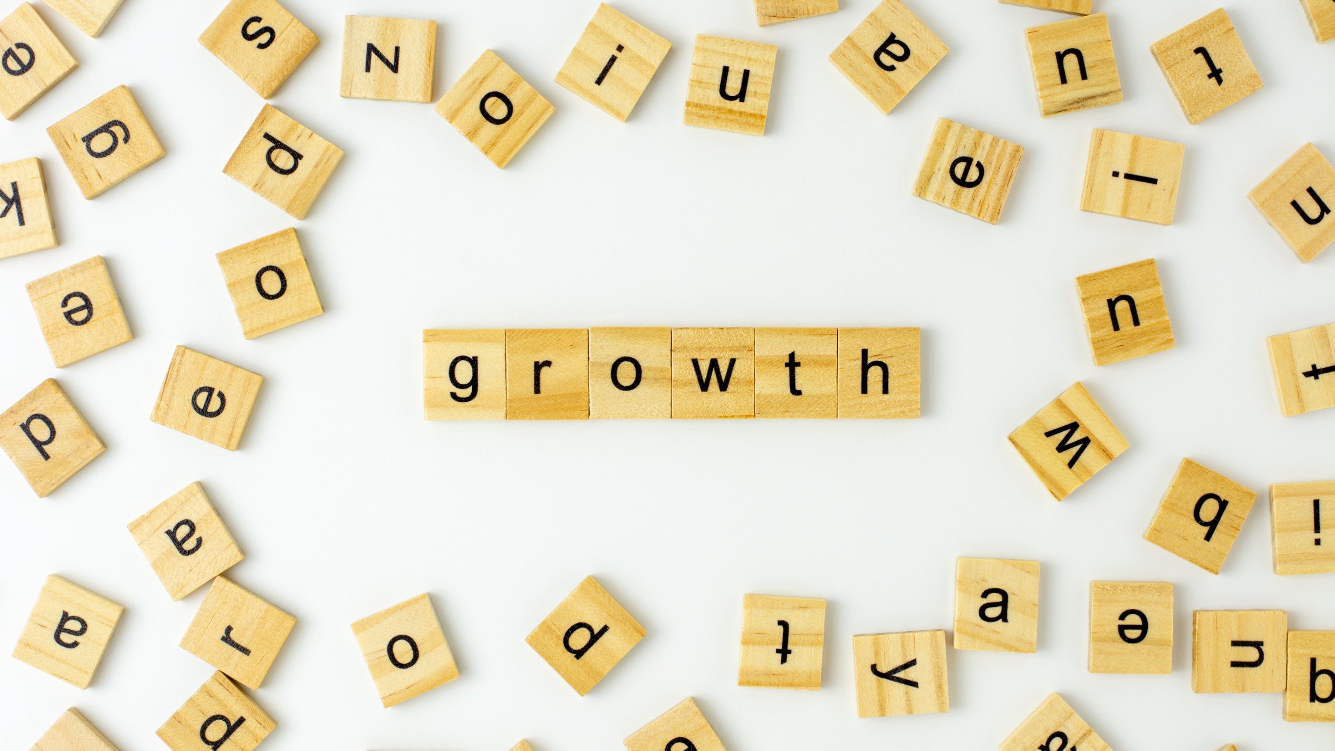 Scrabble letters that spell out the word growth 